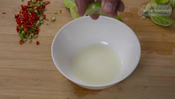 Prepare the dressing: combine lime juice, fish sauce, and palm sugar in a bowl. Mix until the sugar dissolves completely. Adjust seasoning to your taste (sour, salty, sweet, spicy).