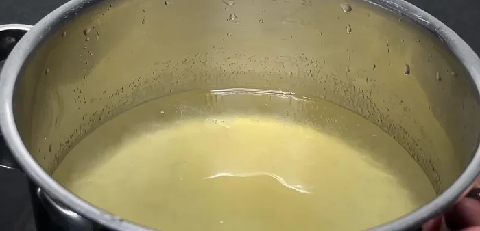 Cook the agar mixture until it melts and softens.