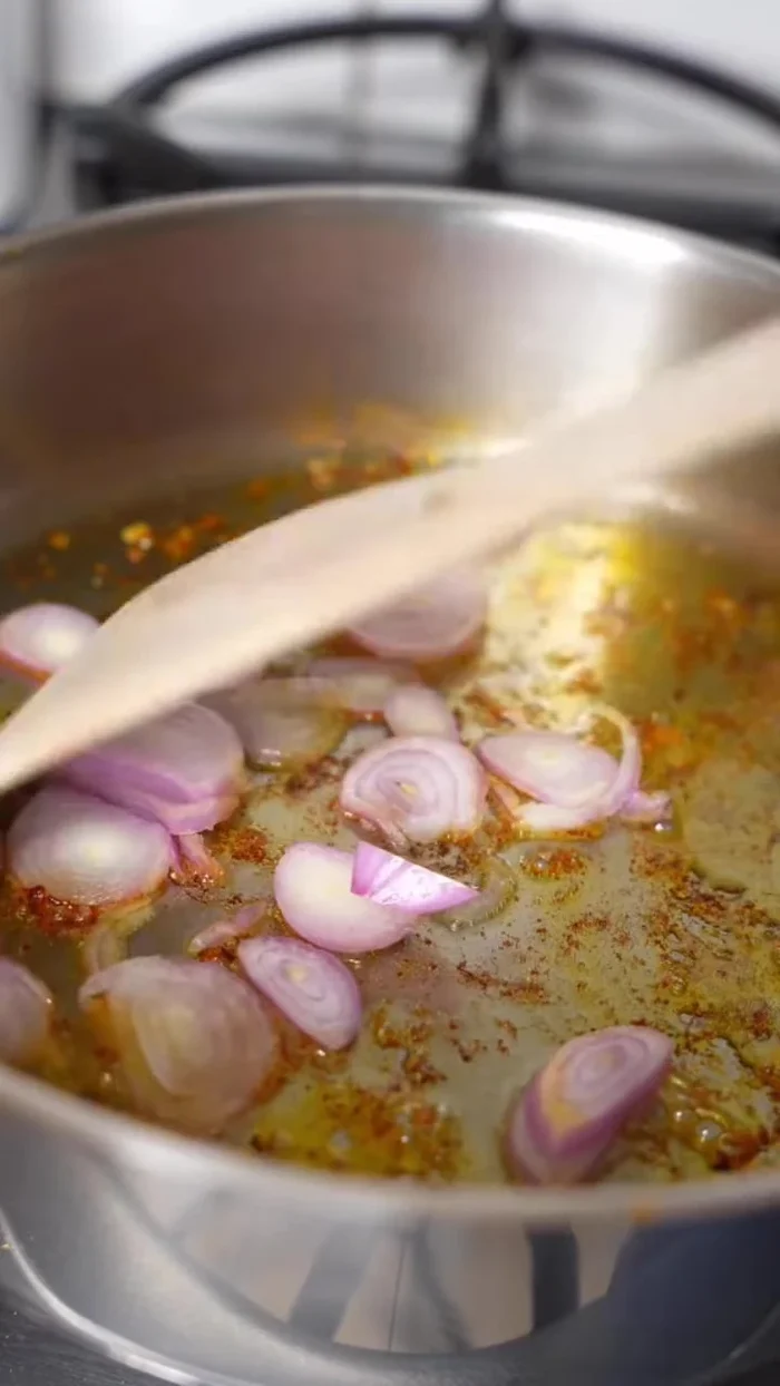 Add dried shallots and garlic to the pan and sauté slightly.