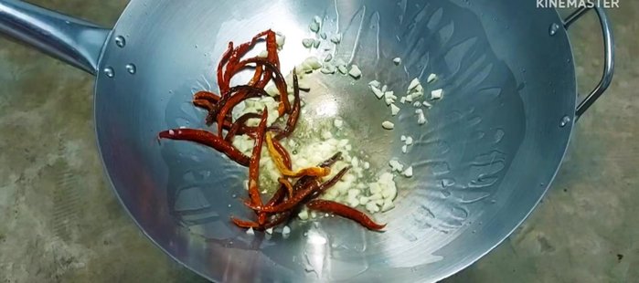 Add chopped garlic and stir-fry until fragrant.