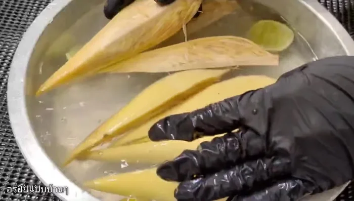 Submerge the tree tops in the lime juice, ensuring they are fully coated. Press down with a plate or bowl to keep them submerged.