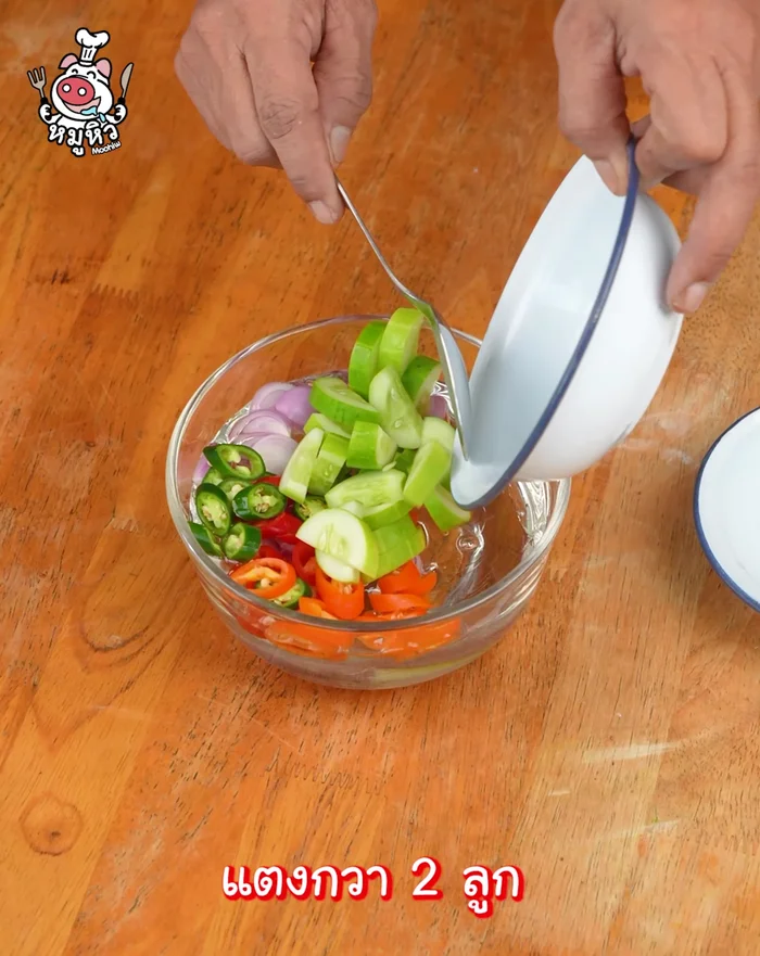 Prepare the dipping sauce: mix shallots, colorful chilies, and cucumbers.