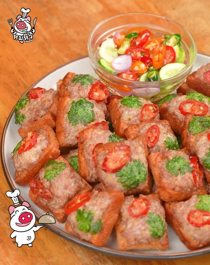 Serve the crispy pork bread with the dipping sauce.