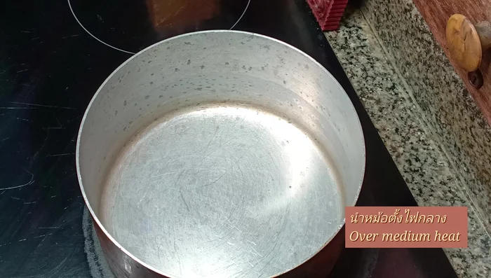 Place a pot over medium heat. Add coconut sugar (ensure it's 100% pure).