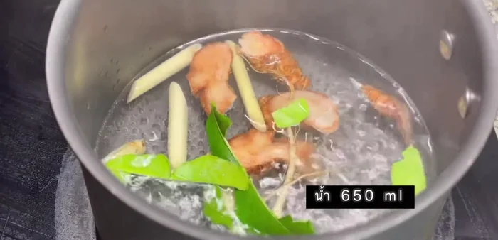 Add water, seasoning powder, and curry paste to the pot.