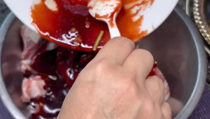 Pour the marinade over the pork, knead for 5-10 minutes to ensure the marinade is absorbed.
