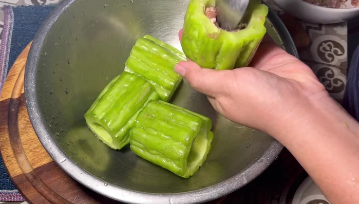 Rinse the bitter melon and fill with the pork and glass noodle mixture.