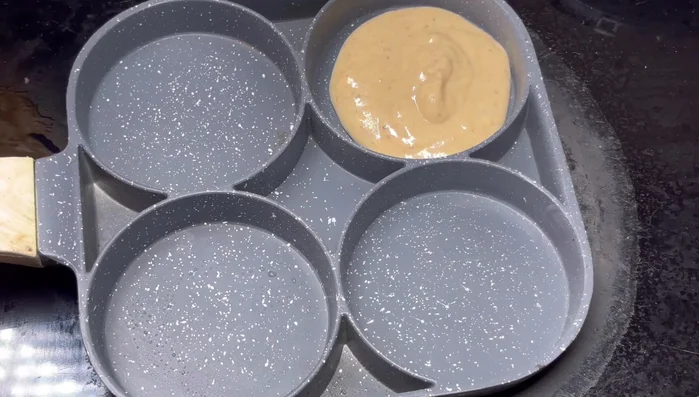 Heat a pan over medium-low heat. Add batter to the hot pan.