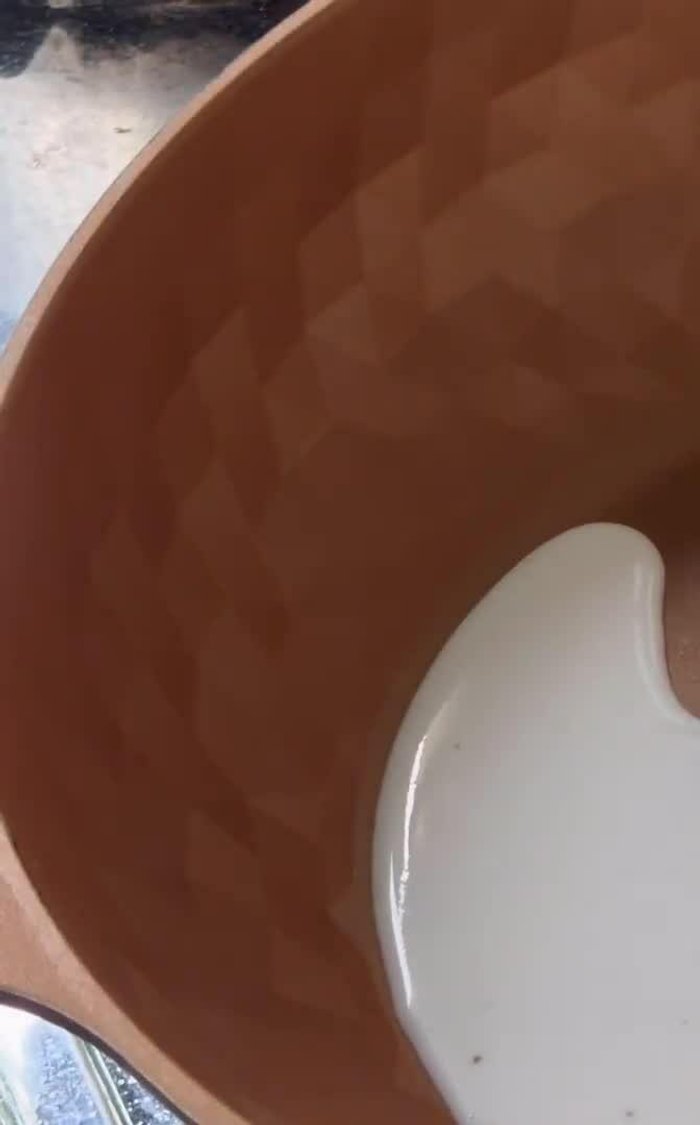 Put the pan on medium heat and pour in the coconut milk.