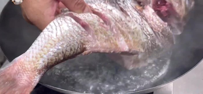 Prepare the fish by cleaning and scaling it. Cut into appropriate serving sizes.