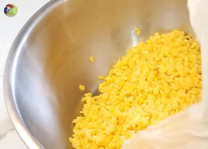 Grind the cooked beans while they are hot.