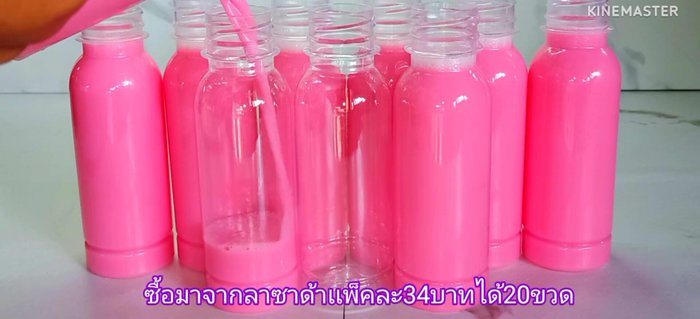 Pour the pink milk into prepared bottles.