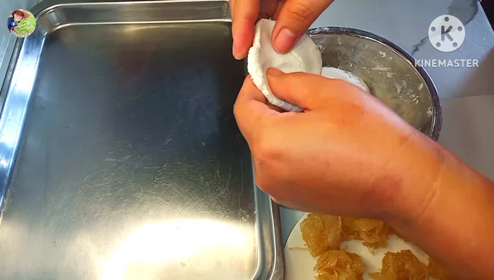 Assemble the dumplings: Roll out small portions of each colored dough into thin circles. Place a spoonful of the filling in the center, and wrap to form a ball.