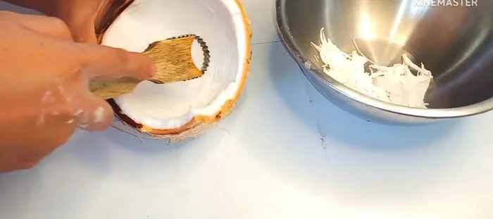 Prepare the coconut topping: Scrape coconut into strips, add a little salt, and steam for 5 minutes.