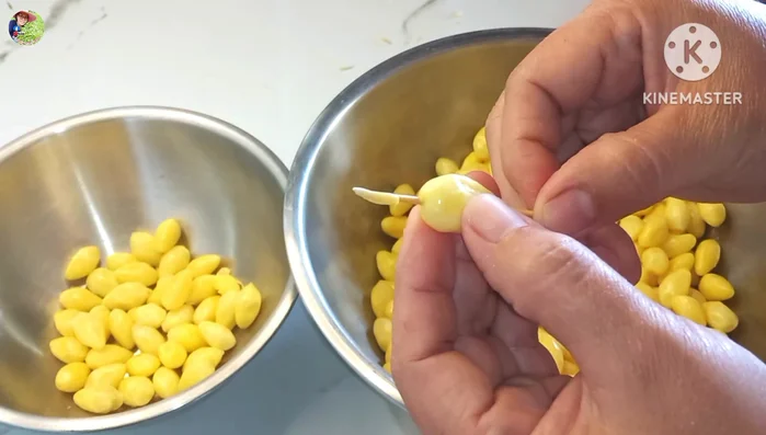 Remove the black dots (sprouts) from each ginkgo nut using a toothpick. Some may require squeezing gently.