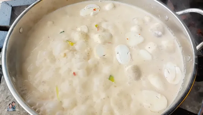 Once the pumpkin softens, add straw mushrooms.