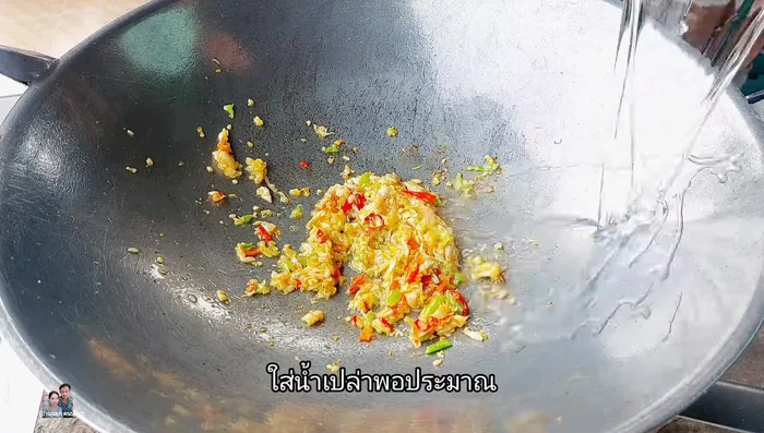 Add a small amount of water to the pan. Add oyster sauce, light soy sauce, fish sauce, white sugar, and stir-fry together.