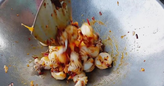 Turn the heat back on. Continue stir-frying until the squid is cooked and slightly shrunk, but not overcooked. (151.28)