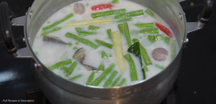 Simmer until the salted fish and green beans are cooked.