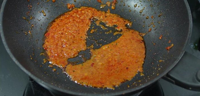 Season with sugar, green cap seasoning sauce, fish sauce, and oyster sauce. Stir-fry to combine.