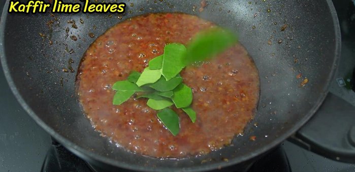 Increase heat. Add shrimp and kaffir lime leaves. Stir-fry until shrimp is cooked.