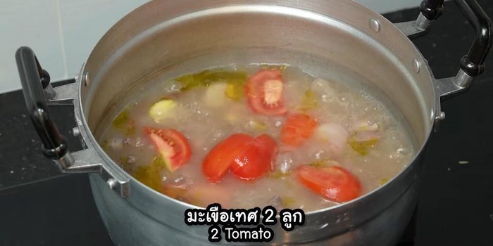 Add tomatoes and chili peppers.
