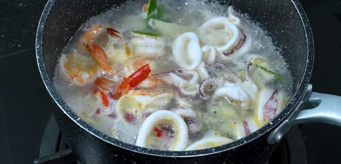 Add basil leaves and cook briefly.