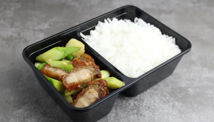 Assemble the dish: Serve crispy pork and kale over rice.