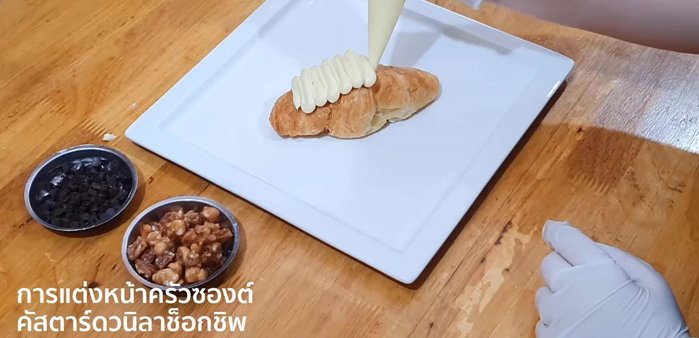 Arrange the croissant, classic mix, and chocolate chips decorations.