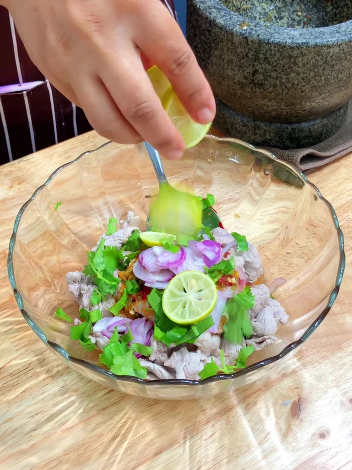 Add lime slices and gently mix everything together.