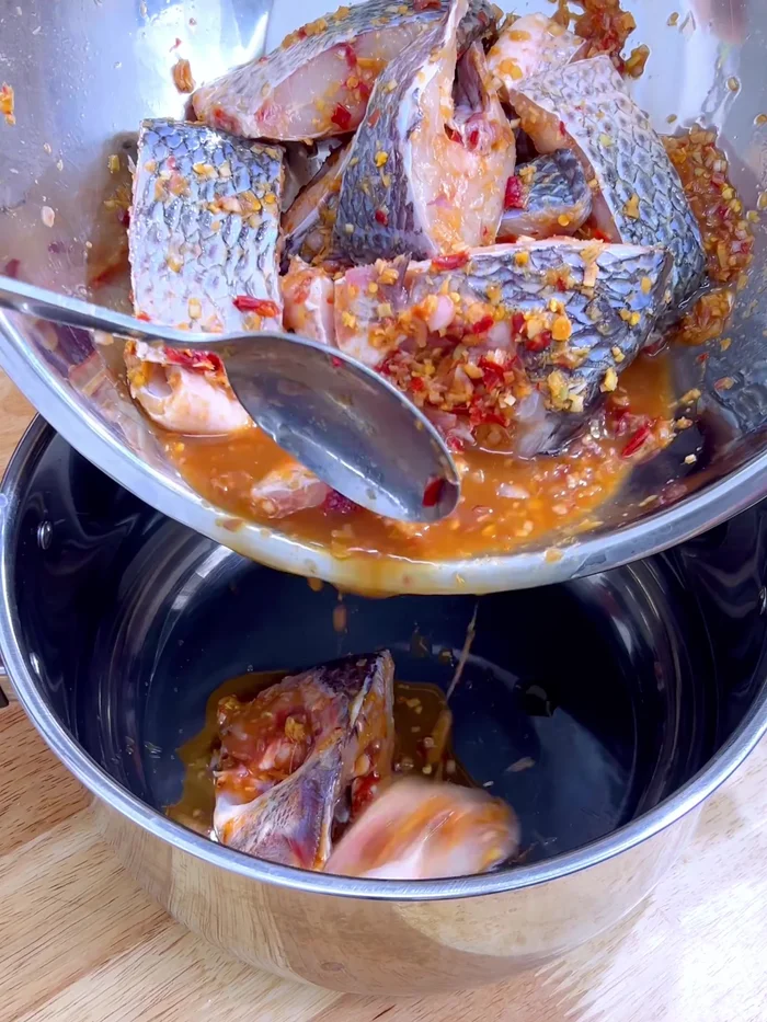 Add the tilapia mixture to the steaming pot.