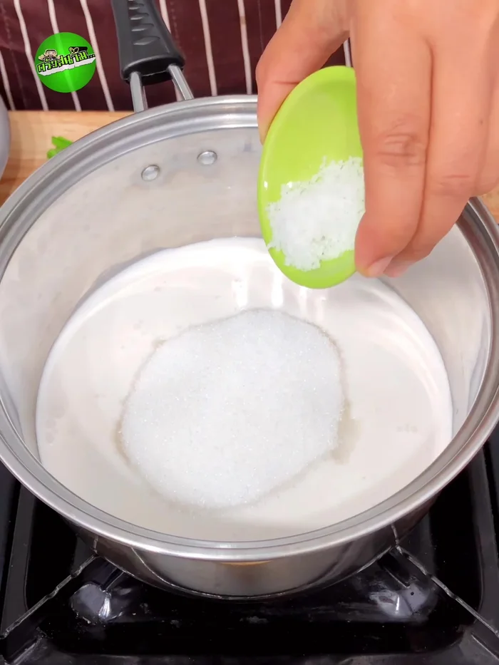 Prepare the coconut milk sauce: Simmer coconut milk, sugar, salt, and pandan leaves until sugar dissolves and the mixture boils. Strain and discard the pandan leaves.