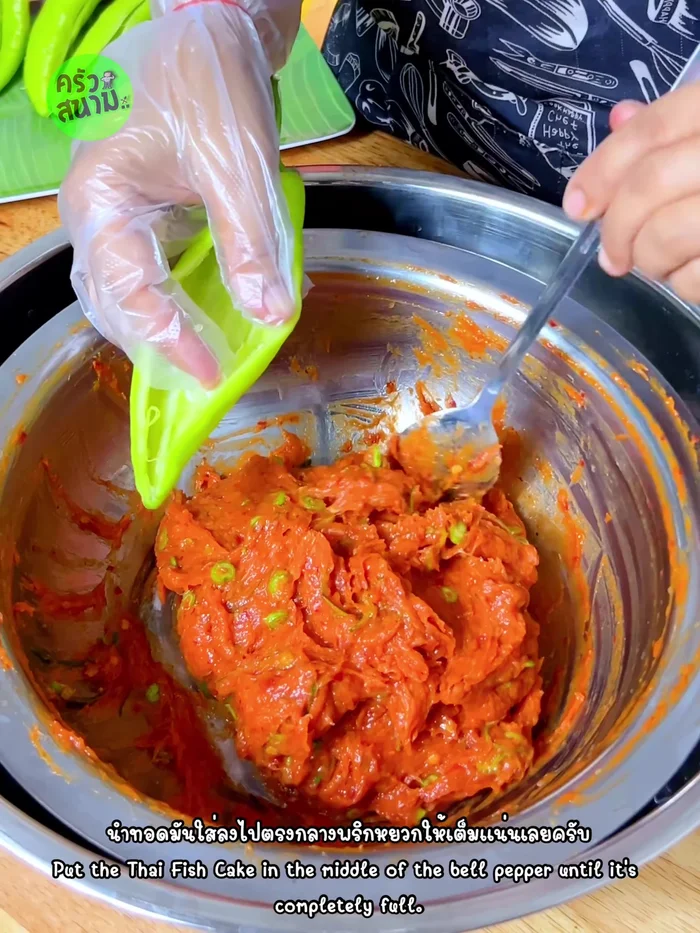 Stuff the fish cake mixture into the prepared bell peppers until full.