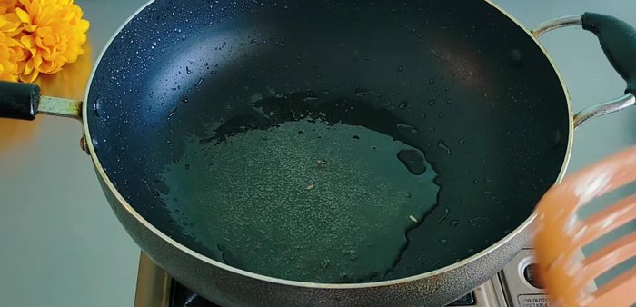 Add instant noodles to the remaining oil in the pan, remove and discard the noodles. Add 100-150ml coconut milk.