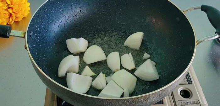 Stir-fry 1 large onion (cut into large pieces) until translucent. Set aside.
