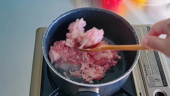 Stir-fry the minced pork until cooked.