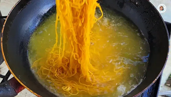 Wash and blanch the noodles until tender.