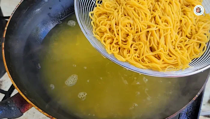Rinse noodles with cold water to prevent sticking.