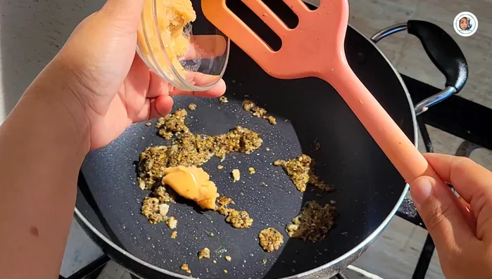 Add palm sugar and stir-fry until dissolved. Add a little water to help dissolve the sugar.