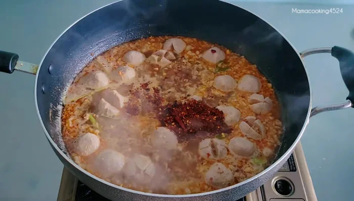 Add roasted peanuts (2 tbsp), chili powder (1 tbsp), and fish sauce (2 tbsp). Adjust amounts to your liking.