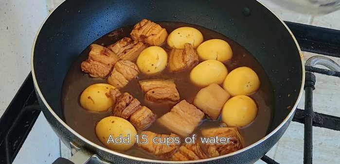 Add about half the remaining water, 2 pieces of star anise, and 1 piece of cinnamon.