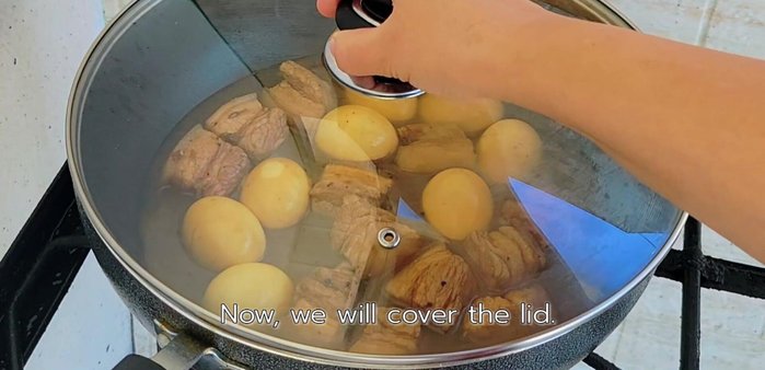 Close the lid and simmer over medium-low heat for 5 minutes. Add 2 more tablespoons of fish sauce.