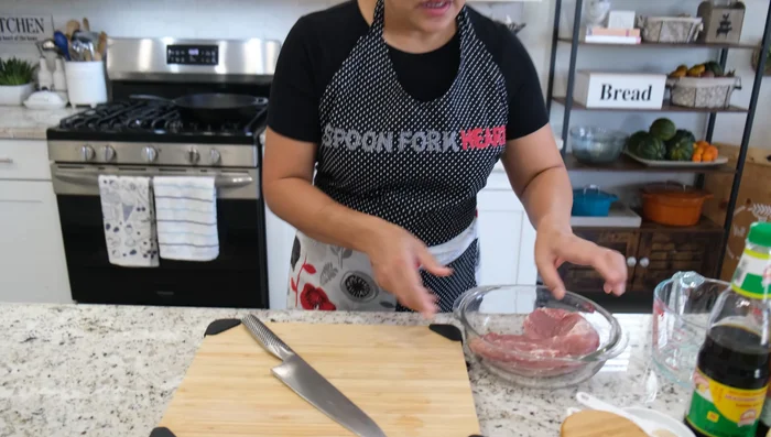 Marinate the pork: Cut the pork tenderloin into half-inch pieces. In a bowl, combine the pork with seasoning soy sauce, black soy sauce, black pepper, and chicken bouillon. Mix well and let it marinate for at least 30 minutes at room temperature.