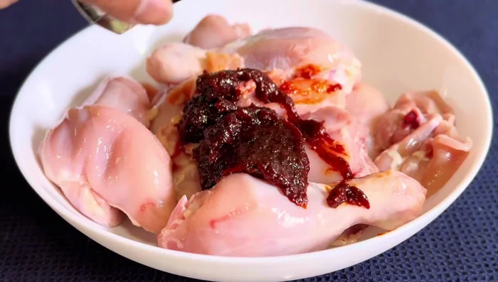 Mix chicken with Thai chili paste, Thai soy sauce, oyster sauce, chicken powder, lemon juice, and salt.