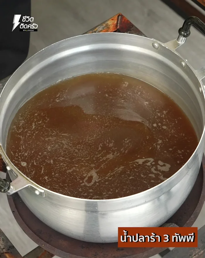 Place a pot on medium heat and pour in water. Bring to a boil, then add fish sauce, shallots, lemongrass, kaffir lime leaves, dried galangal, and chili. Boil until ingredients are cooked and wilted, releasing their aroma.