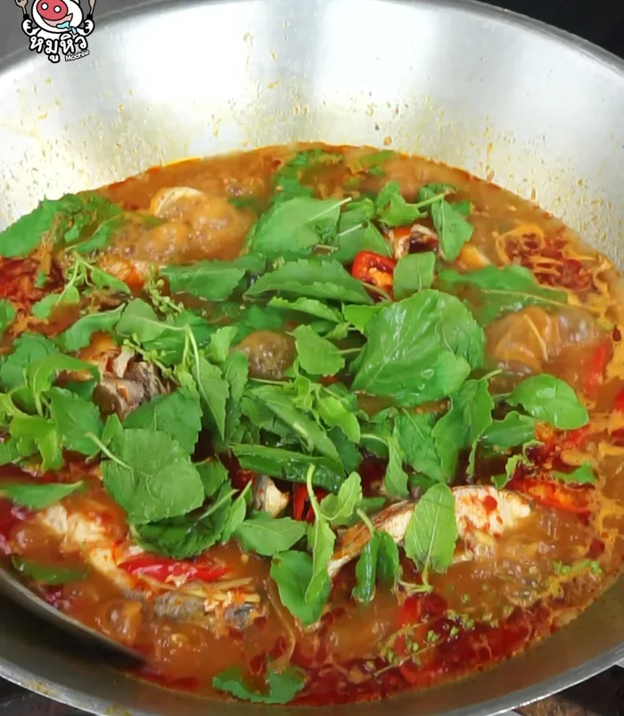 Simmer for another minute to soften the fish.