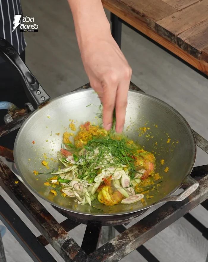 Sprinkle with shredded kaffir lime leaves and stir.